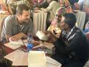 Staff from partner organizations discuss with Job van Rest, from KNCV