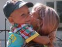 child being held by mom in Kyrgyzstan