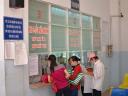 Patients in vietnam at pharmacy window