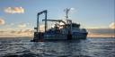 The ship RV Wim Wolff seen while sailing on a quiet sea, just before sunset